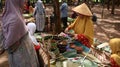 Traditional snack seller, in an old fashioned market, without using plastic wrap