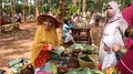 Traditional snack seller, in an old fashioned market, without using plastic wrap