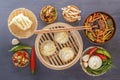 Traditional snacks of Chinese cuisine dim sum - dumplings, spicy salads, vegetables, noodles, steam bread Royalty Free Stock Photo