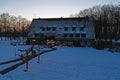 Traditional snowy farm house in winter in the countryside from the Netherlands Royalty Free Stock Photo