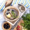 Traditional soup of fresh cabbage and pulp of beef with potatoes, in a wooden bowl on a white background. Nearby is a half-a-half Royalty Free Stock Photo