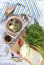 Traditional soup of fresh cabbage and pulp of beef with potatoes, in a wooden bowl on a white background. Nearby is a half-a-half Royalty Free Stock Photo