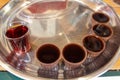 Traditional sour cherry liquer called ginjinha served in chocolate cups