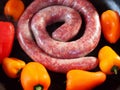 Traditional South African Boerewors With Red And Yellow Peppers