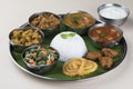 Traditional South Indian Meal or food served on big banana leaf. Royalty Free Stock Photo