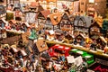 Traditional Souvenirs and toys like smal model houses At European Winter Christmas Market Wooden Souvenir