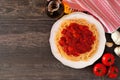 Spaghetti pasta with tomato sauce, peppers and mushrooms, top view corner border on wood with copy space Royalty Free Stock Photo