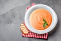 Traditional spanish andalusian tomato cream soup - salmorejo. Salmorejo or gazpacho cream soup on gray bowl, slate gray Royalty Free Stock Photo