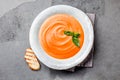 Traditional spanish andalusian tomato cream soup - salmorejo. Salmorejo or gazpacho cream soup on gray bowl, slate gray Royalty Free Stock Photo