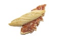 Traditional Spanish bocadillo ham sandwich with a crusty bread isolated on a white background Royalty Free Stock Photo