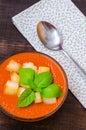 Traditional Spanish cold tomato soup gazpacho with basil and croutons