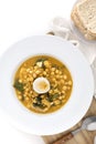 Traditional Spanish cuisine dish that is eaten mainly during the Holy Week holidays. Chickpea, cod, spinach and egg soup.Potaje