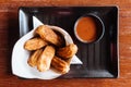 Traditional Spanish dessert Churros with sugar and cinnamon. Served with chocolate sauce Royalty Free Stock Photo