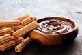 Traditional Spanish dessert churros with sugar and sweet chocolate Royalty Free Stock Photo