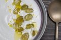 Traditional Spanish dish, cold soup ajo blanco or ajoblanco from garlic, almonds, white wine vinegar, olive oil and grapes Royalty Free Stock Photo