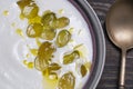 Traditional Spanish dish, cold soup ajo blanco or ajoblanco from garlic, almonds, white wine vinegar, olive oil and grapes Royalty Free Stock Photo