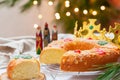 Traditional Spanish Epiphany cake, Roscon de Reyes with festive decorations