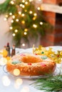 Traditional Spanish Epiphany cake, Roscon de Reyes with festive decorations