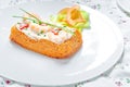 Traditional Spanish fish cake. Hake cake with tomato, shrimps, chive and salad cream