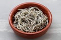 Traditional Spanish food. Gulas with oil in ceramic dish Royalty Free Stock Photo