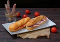 Spanish ham sandwiches with slices fuet and jamon on a white plate Royalty Free Stock Photo