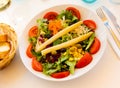 Traditional Spanish mixed salad, made from peas, corn, tomato, lettuce, olives, carrots, asparagus, onions Royalty Free Stock Photo