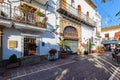 Traditional Spanish narrow street with souvenir shop and beautiful architecture in historical part of town