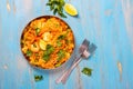 Traditional spanish paella dish with seafood, peas, rice and chicken Royalty Free Stock Photo