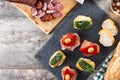 Traditional Spanish pintxos on wooden table Royalty Free Stock Photo
