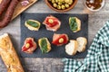 Traditional Spanish pintxos on wooden table Royalty Free Stock Photo