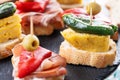 Traditional Spanish pintxos on wooden table Royalty Free Stock Photo