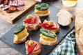 Traditional Spanish pintxos on wooden table Royalty Free Stock Photo