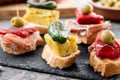 Traditional Spanish pintxos on wooden table Royalty Free Stock Photo