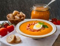 Traditional Spanish Salmorejo Soup. Chilled tomato and bread soup with garnishes