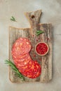 Traditional spanish sausage chorizo on a wooden board. banner, menu, recipe place for text, top view Royalty Free Stock Photo