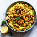 Traditional spanish seafood paella in pan rice, peas, shrimps, mussels, squid on light grey concrete background. Top Royalty Free Stock Photo