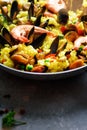 Traditional spanish seafood paella in pan rice, peas, shrimps, mussels, squid on light grey concrete background. Top Royalty Free Stock Photo