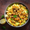 Traditional spanish seafood paella in pan rice, peas, shrimps, mussels, squid on light grey concrete background. Top Royalty Free Stock Photo