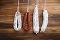 Traditional spanish smoked sausages meat hanging on light wooden background Royalty Free Stock Photo