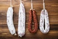 Traditional spanish smoked sausages meat hanging on wood table Royalty Free Stock Photo