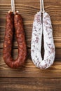 Traditional spanish smoked sausages meat hanging on wood table Royalty Free Stock Photo