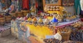 Traditional bazaar with many spices, herbs and clothes Royalty Free Stock Photo