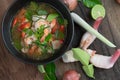 Traditional spicy prawn soup with galangal, lemongrass, kaffir lime leaf and straw mushrooms Royalty Free Stock Photo