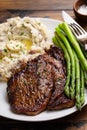 Traditional steak and mashed potatoes with asparagus