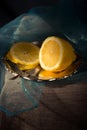 Traditional still life with lemon and a blue scarf Royalty Free Stock Photo