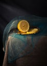 Traditional still life with lemon and a blue scarf Royalty Free Stock Photo