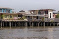 Traditional stilt houses on Chao Phraya's riverbank