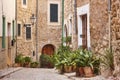 Traditional stone alley decorated with plants in Mallorca, Spain