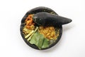 Traditional stone mortar and pestle from Asia with spicy ingredients chilli, yellow seasoning, leaf, leak leaf from Indonesia Royalty Free Stock Photo