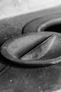 Traditional stove, part of an iron plate close-up covered with ashes in gray tones Royalty Free Stock Photo